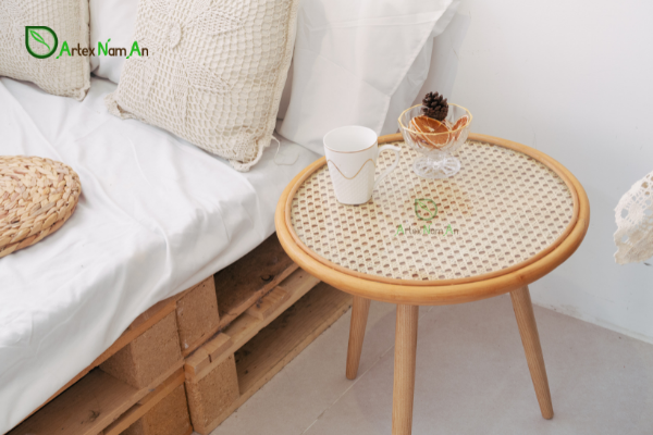 The table is decorated with rattan vs wicker cane webbing on its surface.