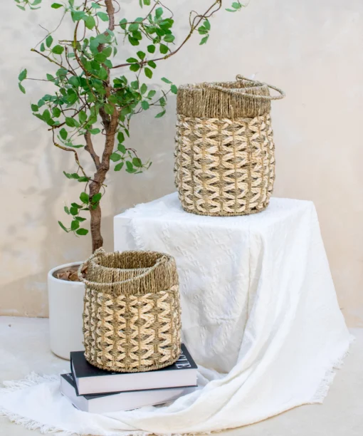 Wholesale Set of 2 Seagrass with Palm leaf Lantern, beautifully handmade and eco friendly for home décor, wedding styling and event decoration. Ideal for farmhouse, contemporary and bohemian interiors. We welcome bulk orders, OEM/ODM collaborations, and private label projects for retailers, wholesalers, sourcing agents and HORECA buyers.