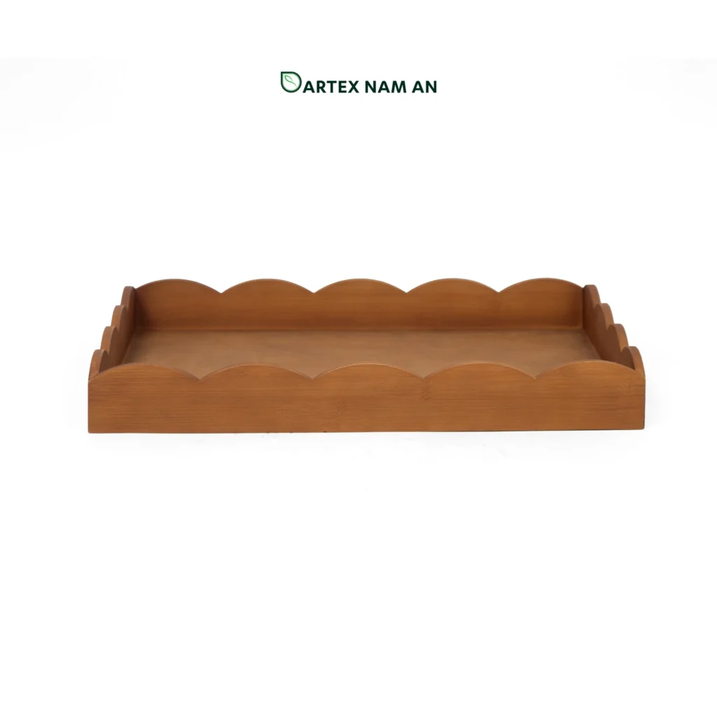 Discover our premium Wholesale Serving Tray crafted from sustainable natural bamboo with a sophisticated black finish. Featuring a unique scalloped "wavy" edge, this eco-friendly tray is perfect for HORECA, office hospitality, and retail. Durable, stylish, and ideal for Japandi or Minimalist interiors. Bulk pricing available.