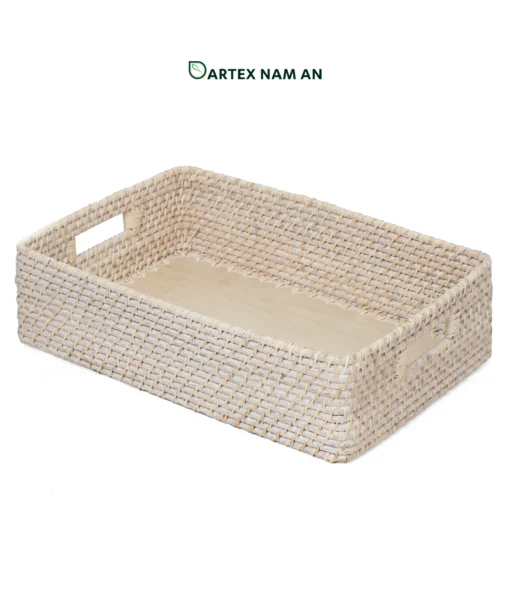 Optimize your organizational inventory with our premium shallow rectangular Wholesale Rattan Basket. Features an elegant whitewashed finish, integrated side handles, and a smooth, solid bamboo base insert. Ideal for HORECA table service, corporate desk sorting, and minimalist home retail displays. Bulk sourcing ready.