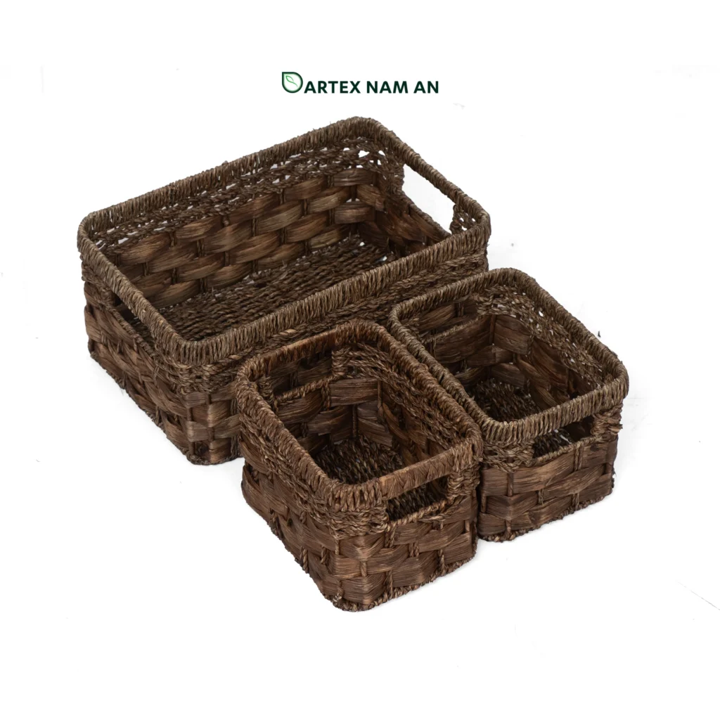 Optimize your shelf displays with our 3-piece nesting Wholesale Storage Basket set. Handwoven from natural dark brown seagrass and water hyacinth. Features 1 large basket and 2 companion insert bins. Ideal for HORECA amenities, corporate office sorting, and retail inventory. Bulk pricing available.