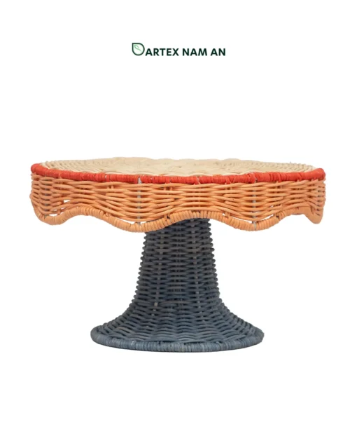Elevate tabletop displays with our Wholesale Pedestal Tray. Handwoven from natural rattan featuring a scalloped apron, red trim accent, and dark slate grey base for HORECA buffets, corporate offices, and lifestyle retail. Bulk order ready.